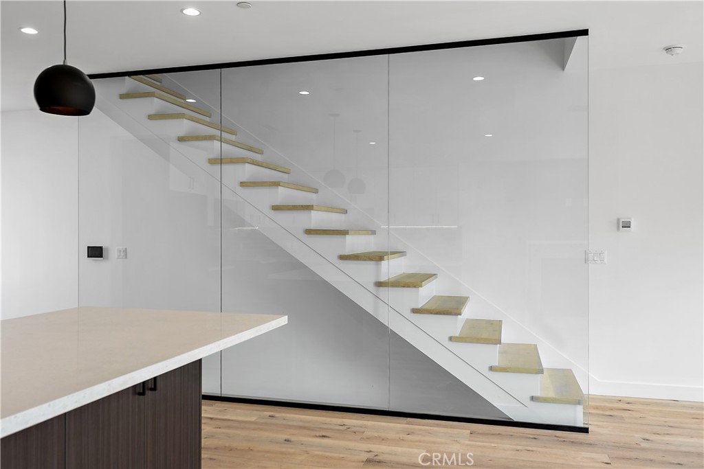 11857 West Flower Ln Valley Village Valley Village, CA 91607 - Photo 39 of 54 a hallway with windows and white walls