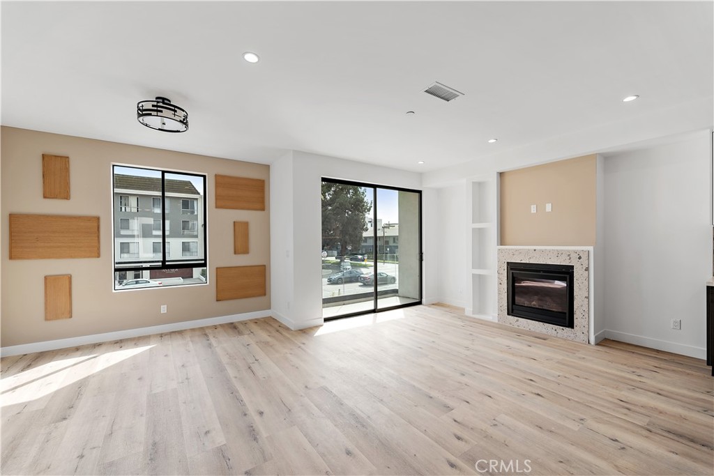 11857 West Flower Ln Valley Village Valley Village, CA 91607 - Photo 41 of 54 a view of an empty room with a window and fireplace