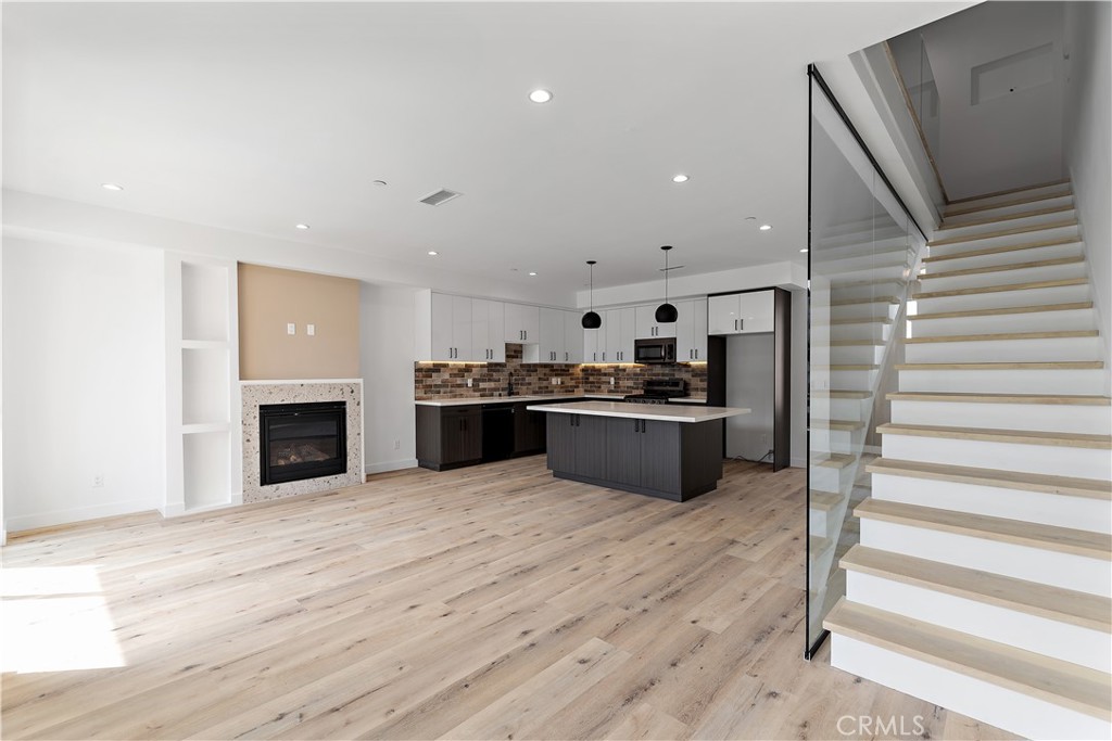 11857 West Flower Ln Valley Village Valley Village, CA 91607 - Photo 43 of 54 a kitchen with stainless steel appliances a stove top oven and cabinets