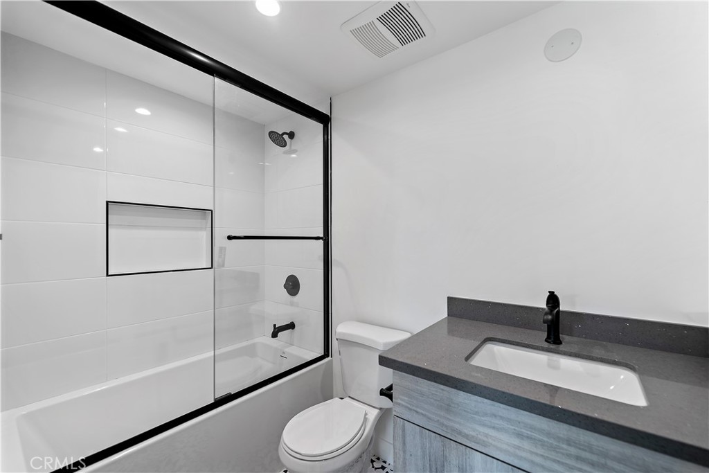 11857 West Flower Ln Valley Village Valley Village, CA 91607 - Photo 44 of 54 a bathroom with a toilet a sink and a mirror