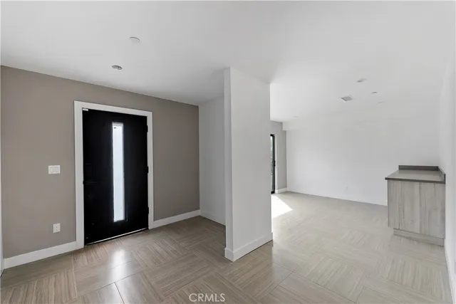 a view of a yard with potted plants and trees