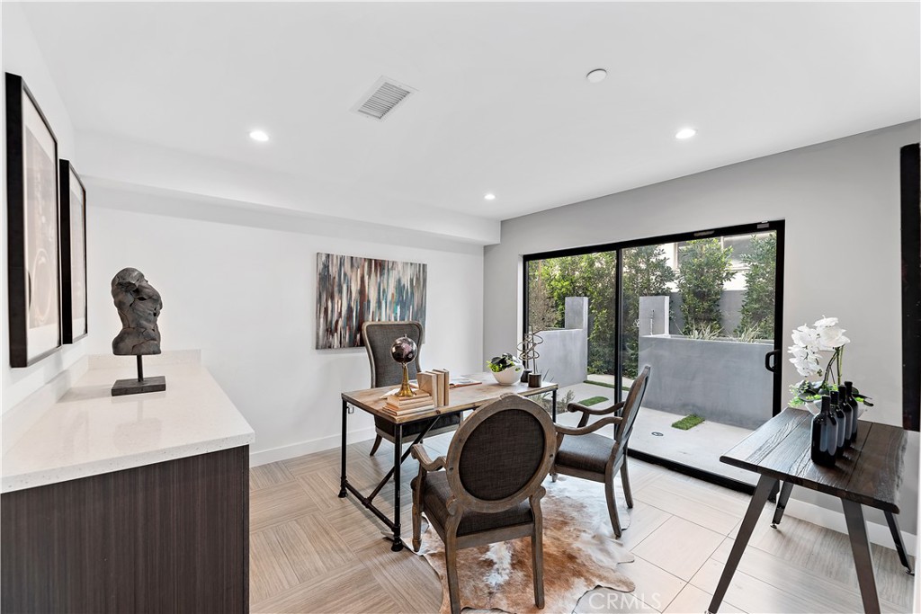 11857 West Flower Ln Valley Village Valley Village, CA 91607 - Photo 5 of 54 a work room with furniture and wooden floor