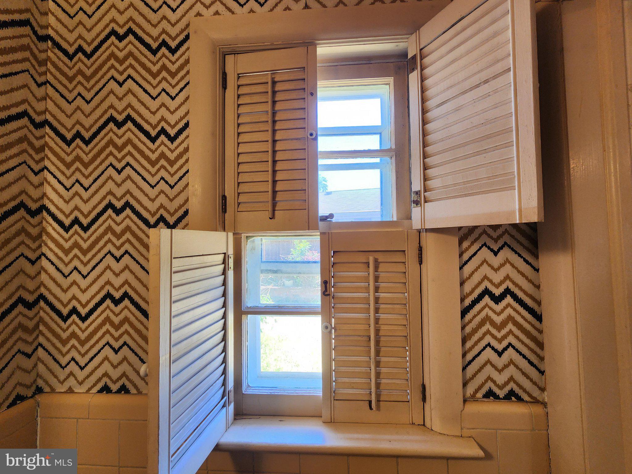 9709 Admiralty Drive Silver Spring, MD 20910 - Photo 17 of 39 Charming window with stylish shutters.