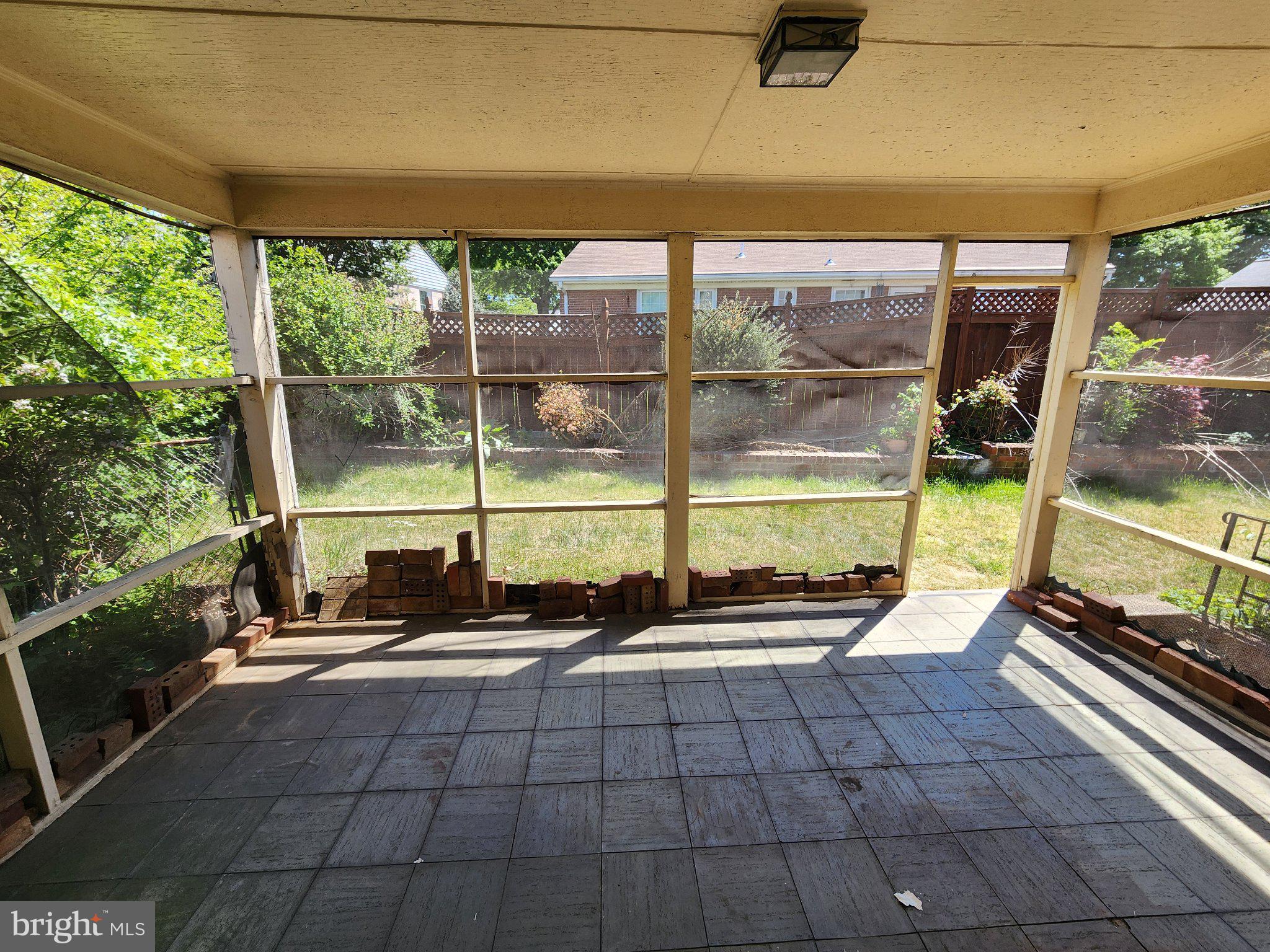 9709 Admiralty Drive Silver Spring, MD 20910 - Photo 36 of 39 Serene screened porch with garden view.