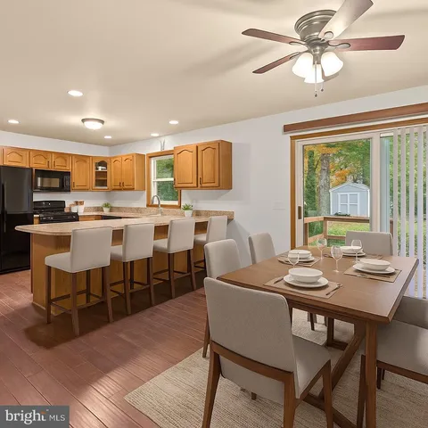 a view of a dining room with furniture window and outside view