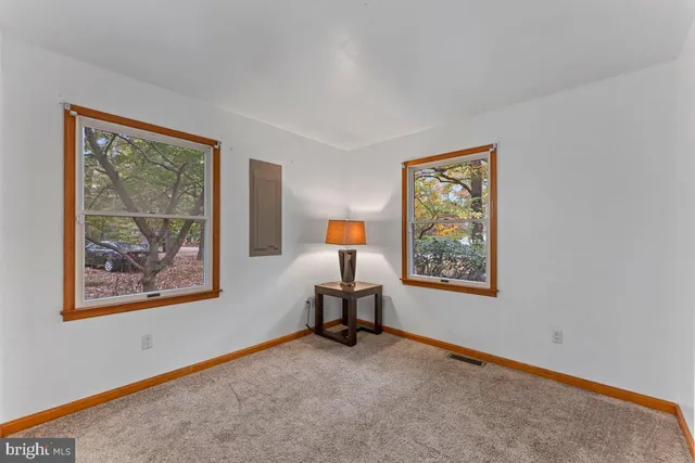 a room with painting and windows