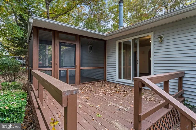 a view of porch with wooden stairs and stairs