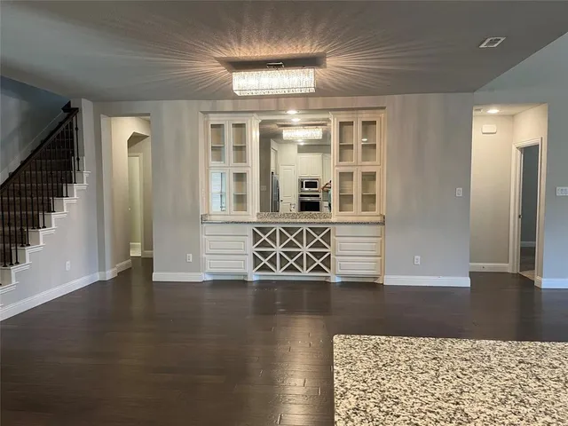 a view of an entryway with wooden floor