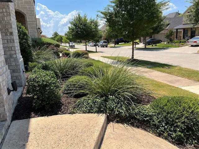 a view of swimming pool with a yard