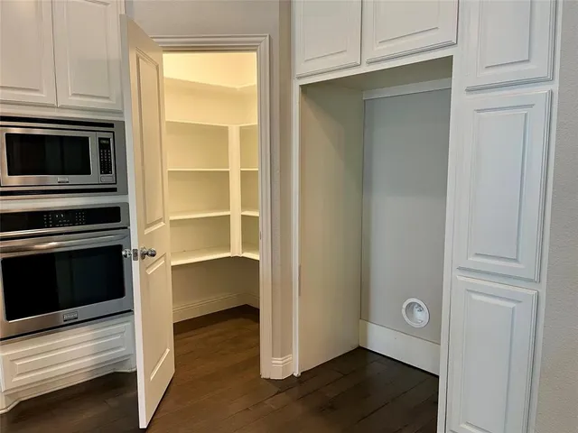 a view of kitchen with wooden floor and oven