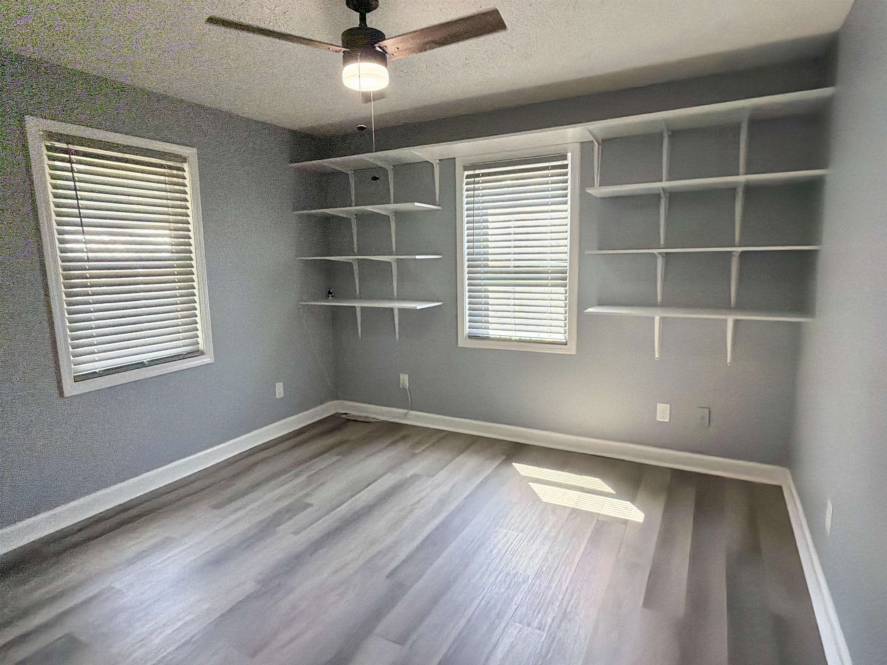 8022 45th Highway Ramer, TN 38367 - Photo 11 of 21 Wood-finish flooring with a ceiling fan light fixture