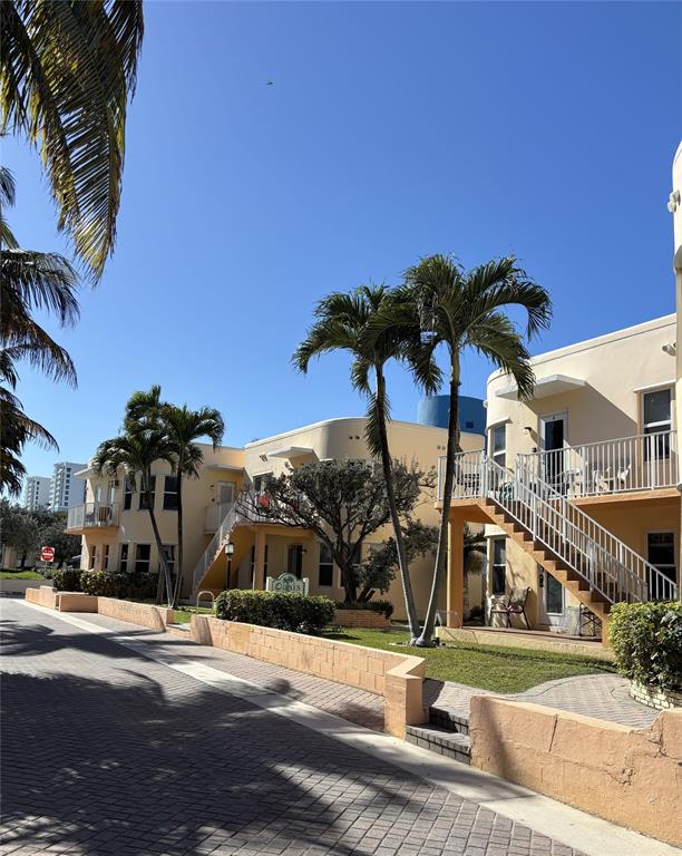 330 Arthur Street, Unit 115 Hollywood, FL 33019 - Photo 15 of 17 a view of a street with houses