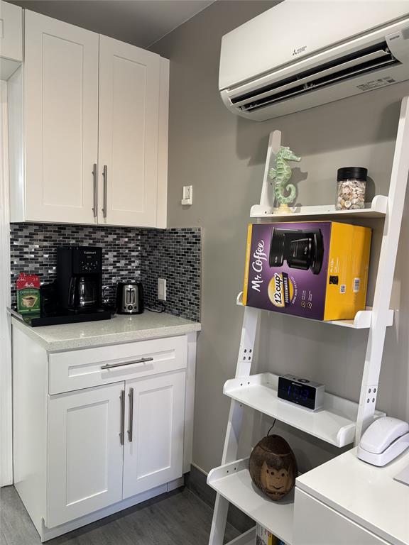 330 Arthur Street, Unit 115 Hollywood, FL 33019 - Photo 5 of 17 a kitchen with a stove and cabinets