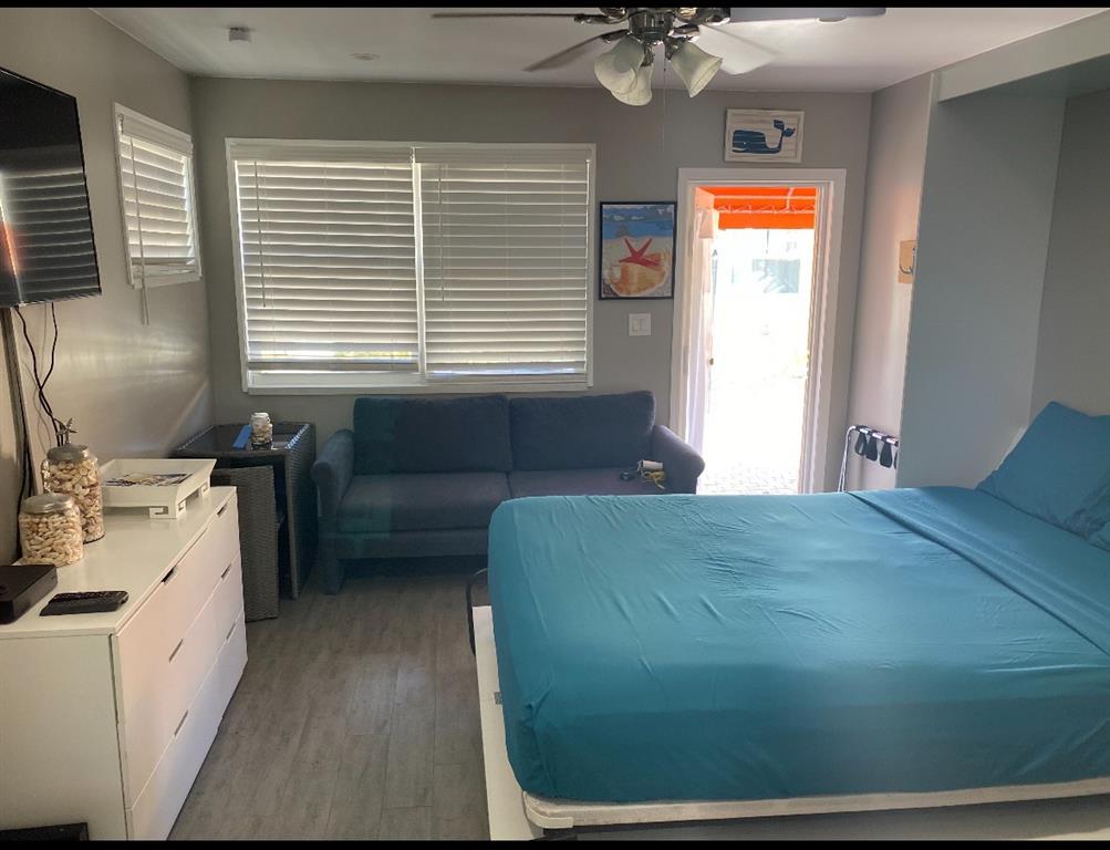 330 Arthur Street, Unit 115 Hollywood, FL 33019 - Photo 7 of 17 a bedroom with a bed and a window