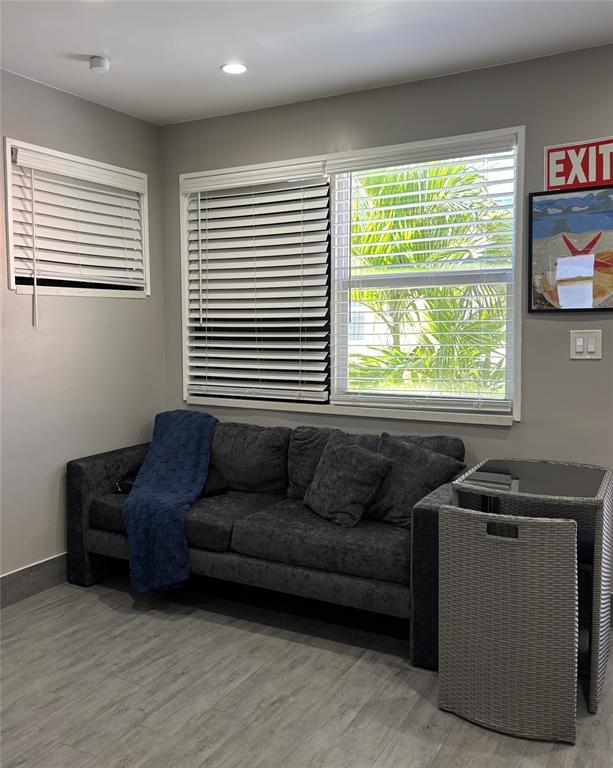 330 Arthur Street, Unit 115 Hollywood, FL 33019 - Photo 9 of 17 a living room with furniture and a window