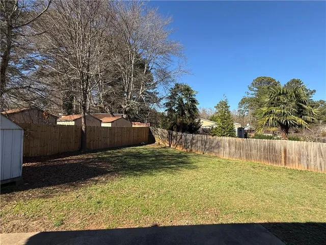 a view of swimming pool with a yard