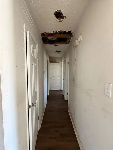 a view of a hallway with a wooden floor