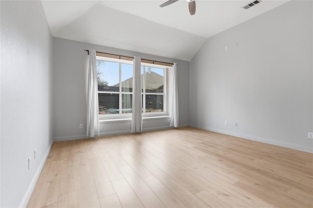 5914 Ambassador Lane Rowlett, TX 75089 - Photo 11 of 40 an empty room with wooden floor and windows