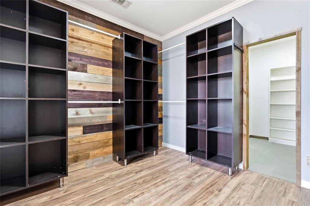 5914 Ambassador Lane Rowlett, TX 75089 - Photo 16 of 40 a view of walk in closet with empty racks