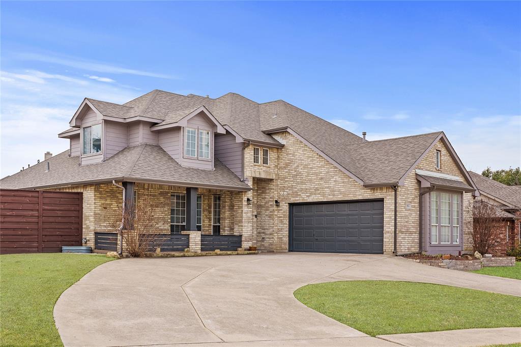 5914 Ambassador Lane Rowlett, TX 75089 - Photo 2 of 40 a front view of a house with a garden and yard
