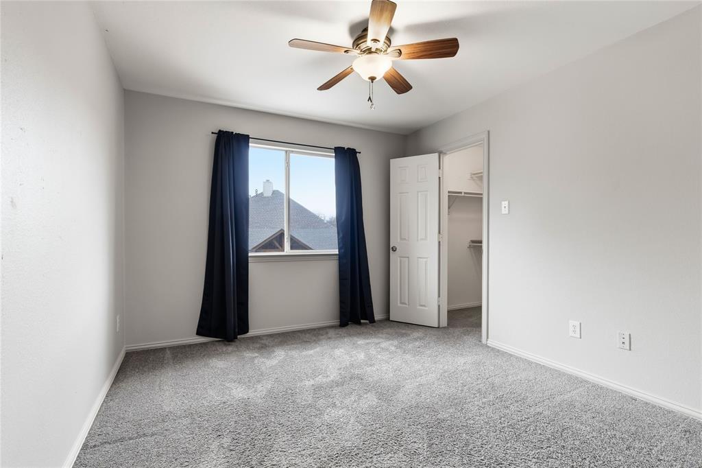 5914 Ambassador Lane Rowlett, TX 75089 - Photo 29 of 40 a view of empty room with ceiling fan