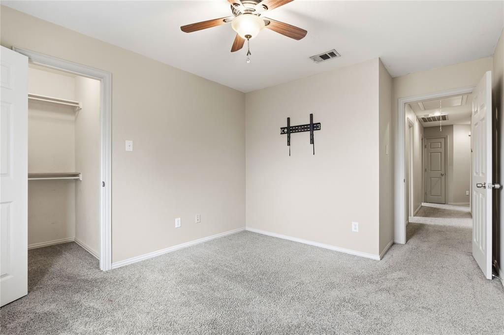 5914 Ambassador Lane Rowlett, TX 75089 - Photo 30 of 40 a view of an empty room with a ceiling fan