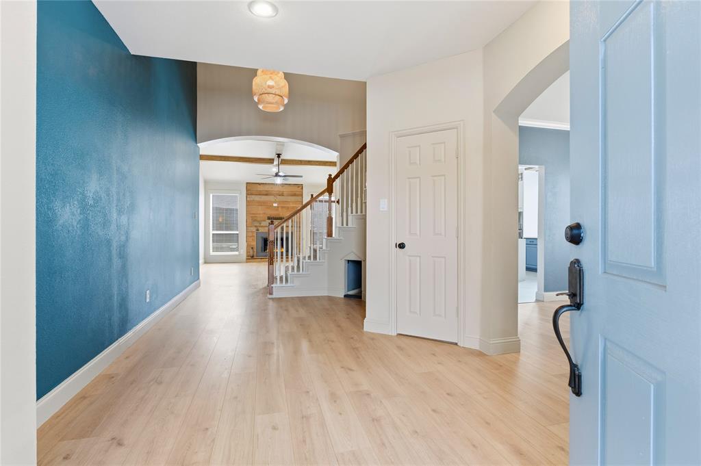 5914 Ambassador Lane Rowlett, TX 75089 - Photo 3 of 40 a view of a hallway with wooden floor