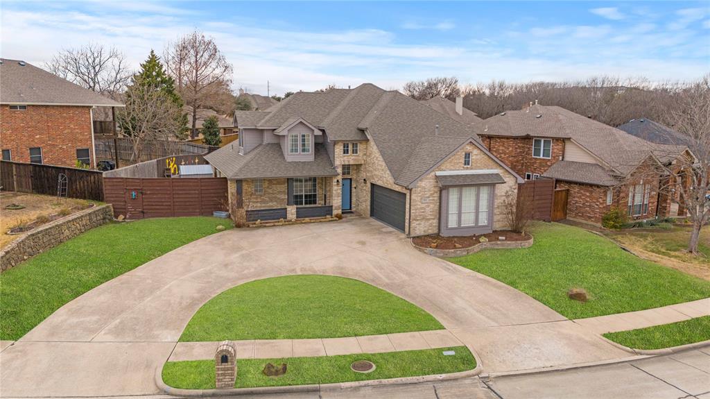 5914 Ambassador Lane Rowlett, TX 75089 - Photo 37 of 40 a view of a big house with a big yard and large tree