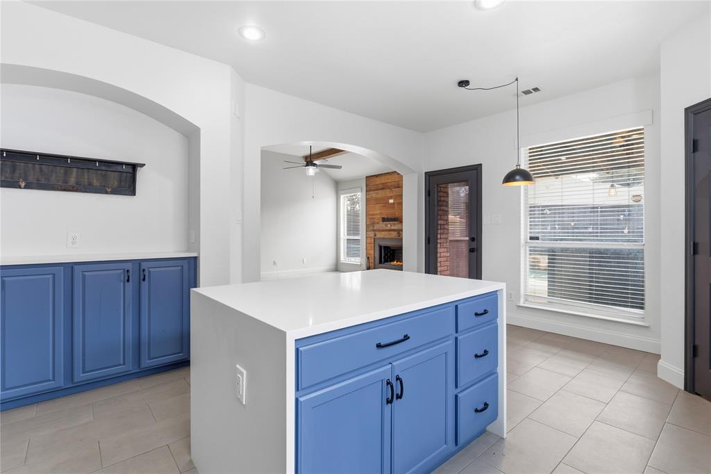 5914 Ambassador Lane Rowlett, TX 75089 - Photo 7 of 40 a kitchen with a wooden cabinets and a stove