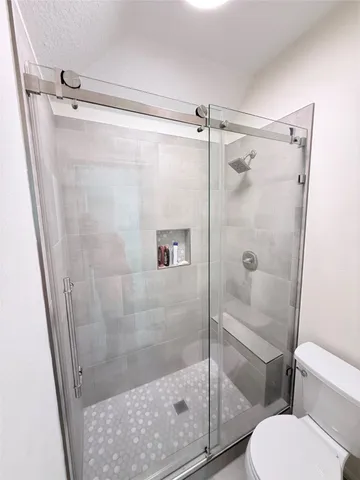 a view of a house with backyard porch and sitting area