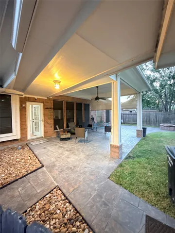 a view of a house with swimming pool and porch