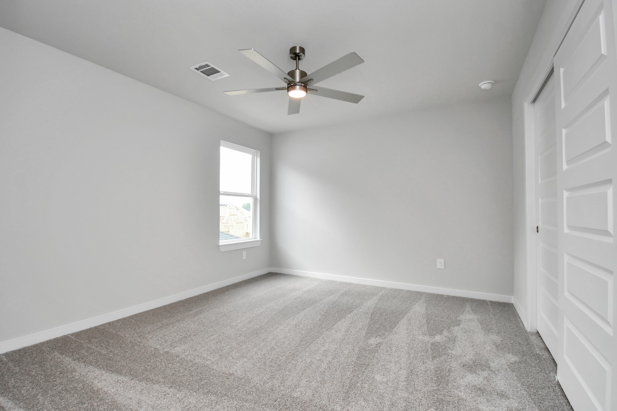 3043 Native Spg Drive Spring, TX 77373 - Photo 36 of 39 Secondary bedroom features plush carpeting, large windows that let in plenty of natural light, bright paint, and spacious closets. Sample photo of completed home with similar floor plan. Actual colors and selections may vary.