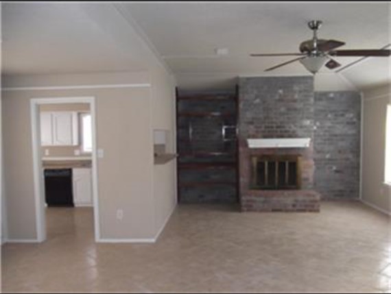 22603 Millgate Drive Spring, TX 77373 - Photo 5 of 7 an empty room with a fireplace and cabinet