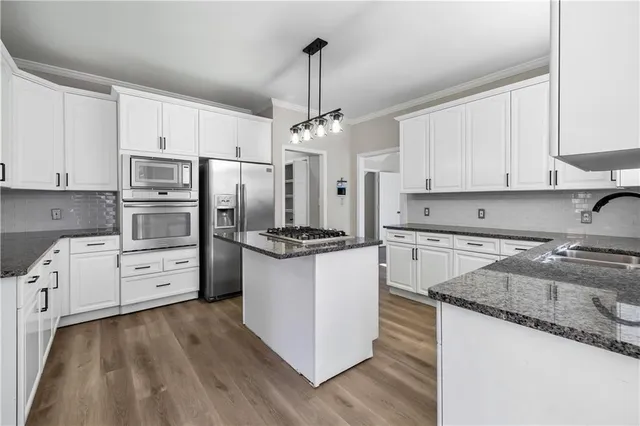 a view of an empty room with window and fire place