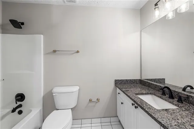 an empty room with wooden floor and closet