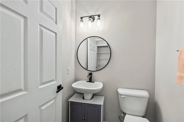 a bathroom with a sink and a window