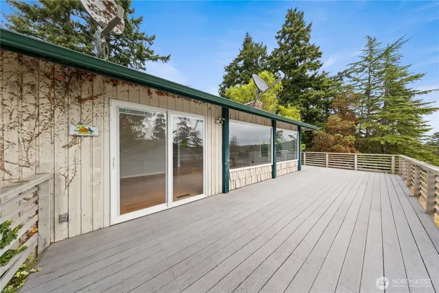 a view of outdoor space with deck and yard