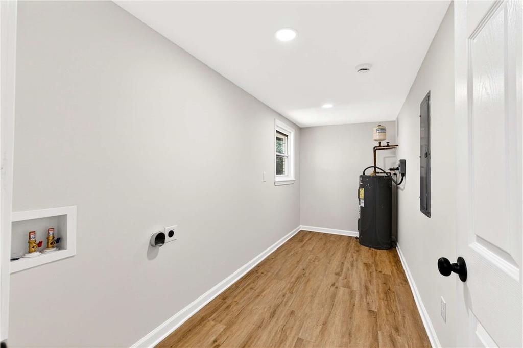 2497 Glenrock Drive Decatur, GA 30032 - Photo 12 of 42 a view of a hallway with wooden floor