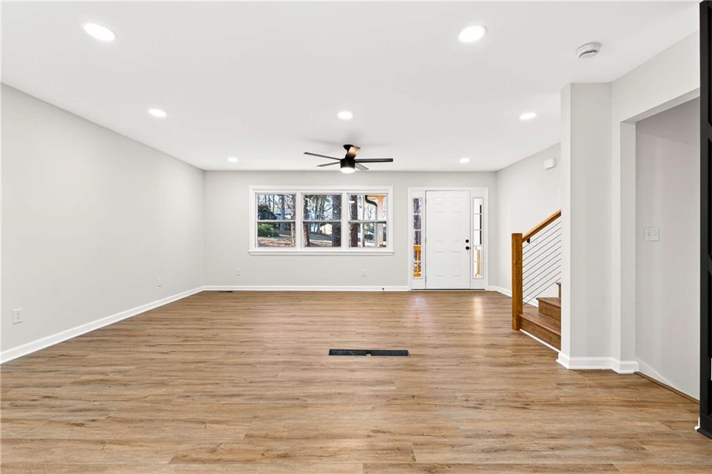 2497 Glenrock Drive Decatur, GA 30032 - Photo 14 of 42 a view of an empty room with wooden floor and a window