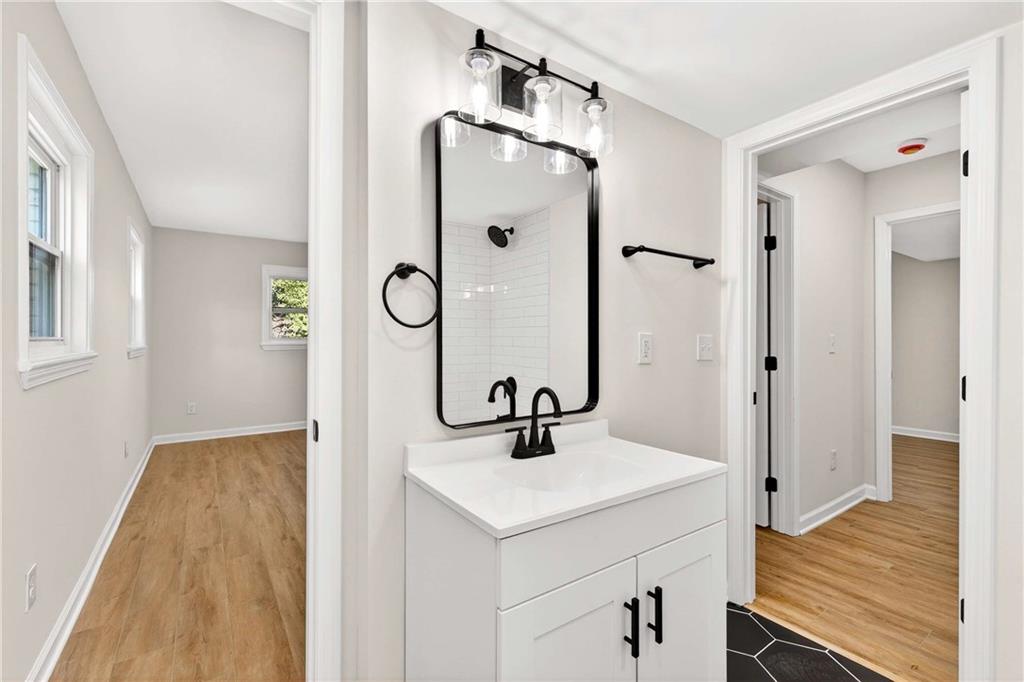 2497 Glenrock Drive Decatur, GA 30032 - Photo 16 of 42 a bathroom with a sink and a mirror