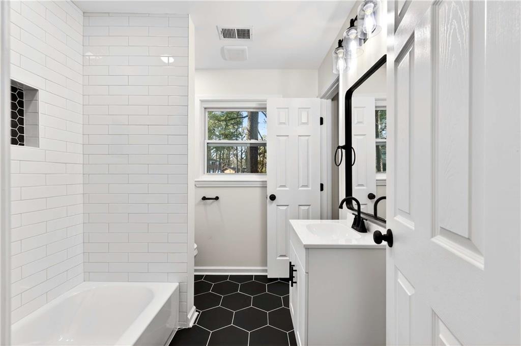 2497 Glenrock Drive Decatur, GA 30032 - Photo 22 of 42 a bathroom with a bathtub and a sink