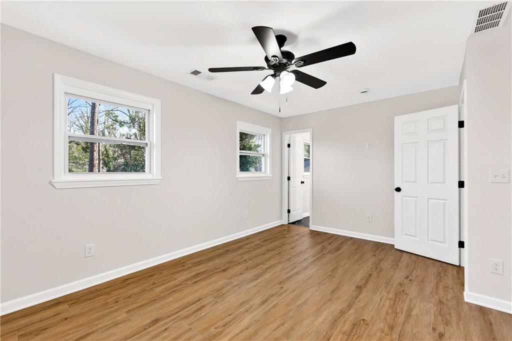 2497 Glenrock Drive Decatur, GA 30032 - Photo 27 of 42 a view of a big room with wooden floor closet and windows