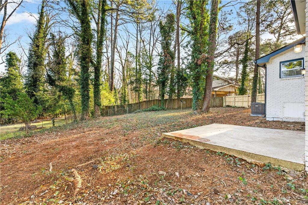 2497 Glenrock Drive Decatur, GA 30032 - Photo 35 of 42 a view of a yard with plants and trees