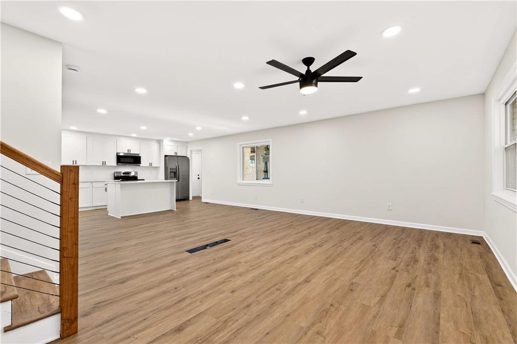 2497 Glenrock Drive Decatur, GA 30032 - Photo 5 of 42 a view of empty room with wooden floor and window