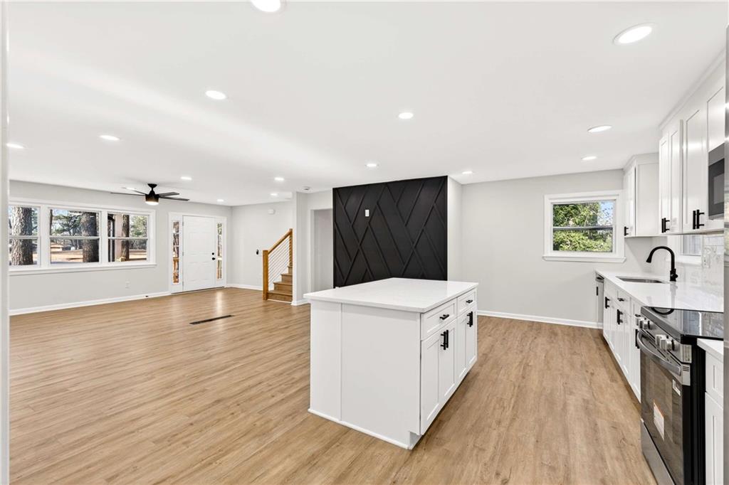 2497 Glenrock Drive Decatur, GA 30032 - Photo 10 of 42 a view of a kitchen with a sink and wooden floor