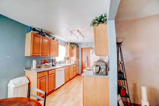 a view of a kitchen and utility room