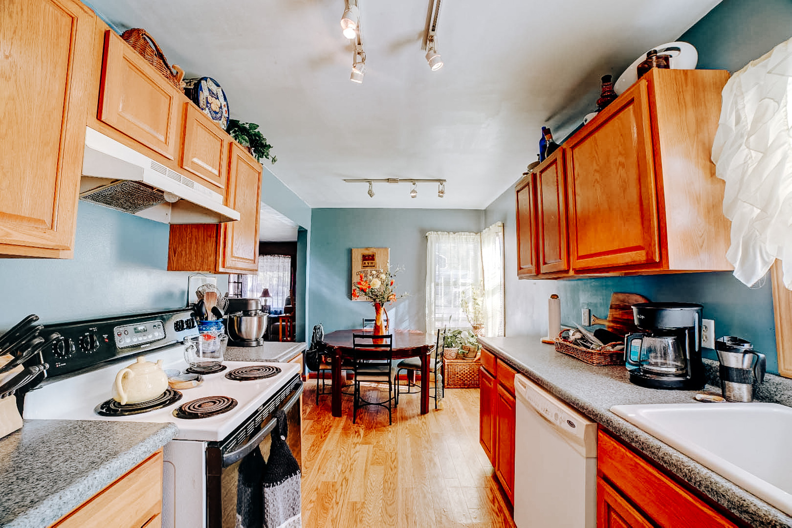 615 South 5th Street Watseka, IL 60970 - Photo 16 of 26 a kitchen with stainless steel appliances granite countertop a stove a sink dishwasher and cabinets with wooden floor