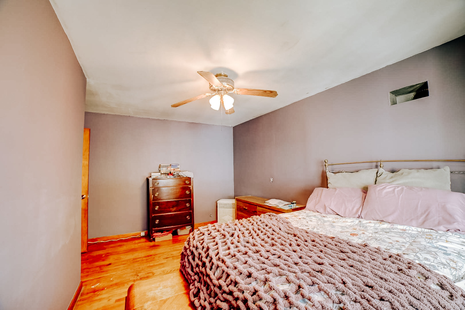 615 South 5th Street Watseka, IL 60970 - Photo 19 of 26 a bedroom with a bed and a chandelier
