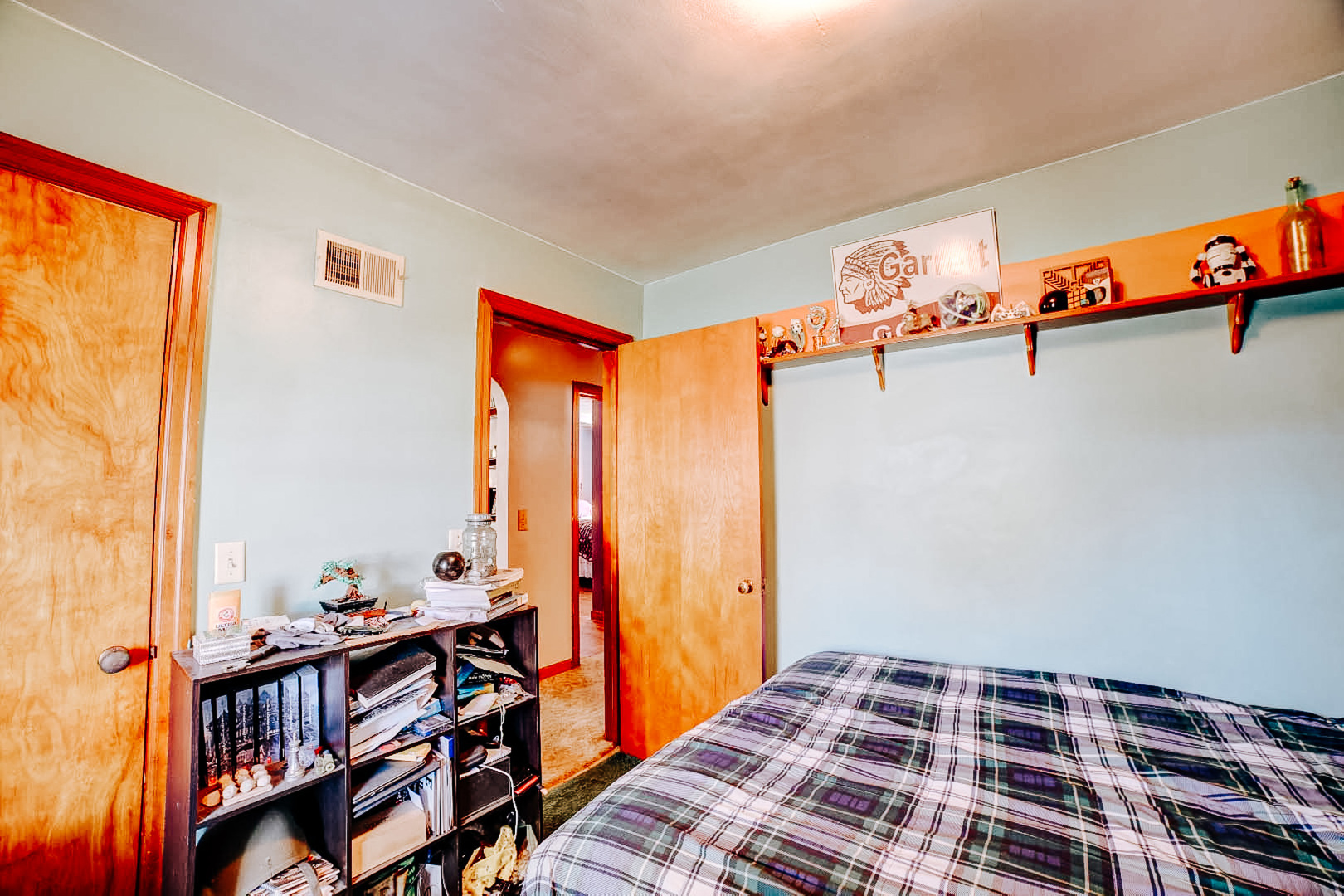 615 South 5th Street Watseka, IL 60970 - Photo 22 of 26 a bedroom with a bed and a book shelf