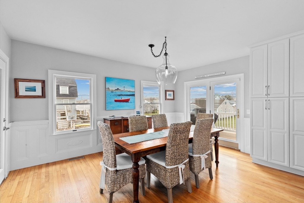 79 Surfside Road Scituate, MA 02066 - Photo 15 of 42 a view of a dining room with furniture window and wooden floor
